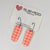 Earrings - Neon Orange Houndstooth Pill Shape Earrings on Black Hoops